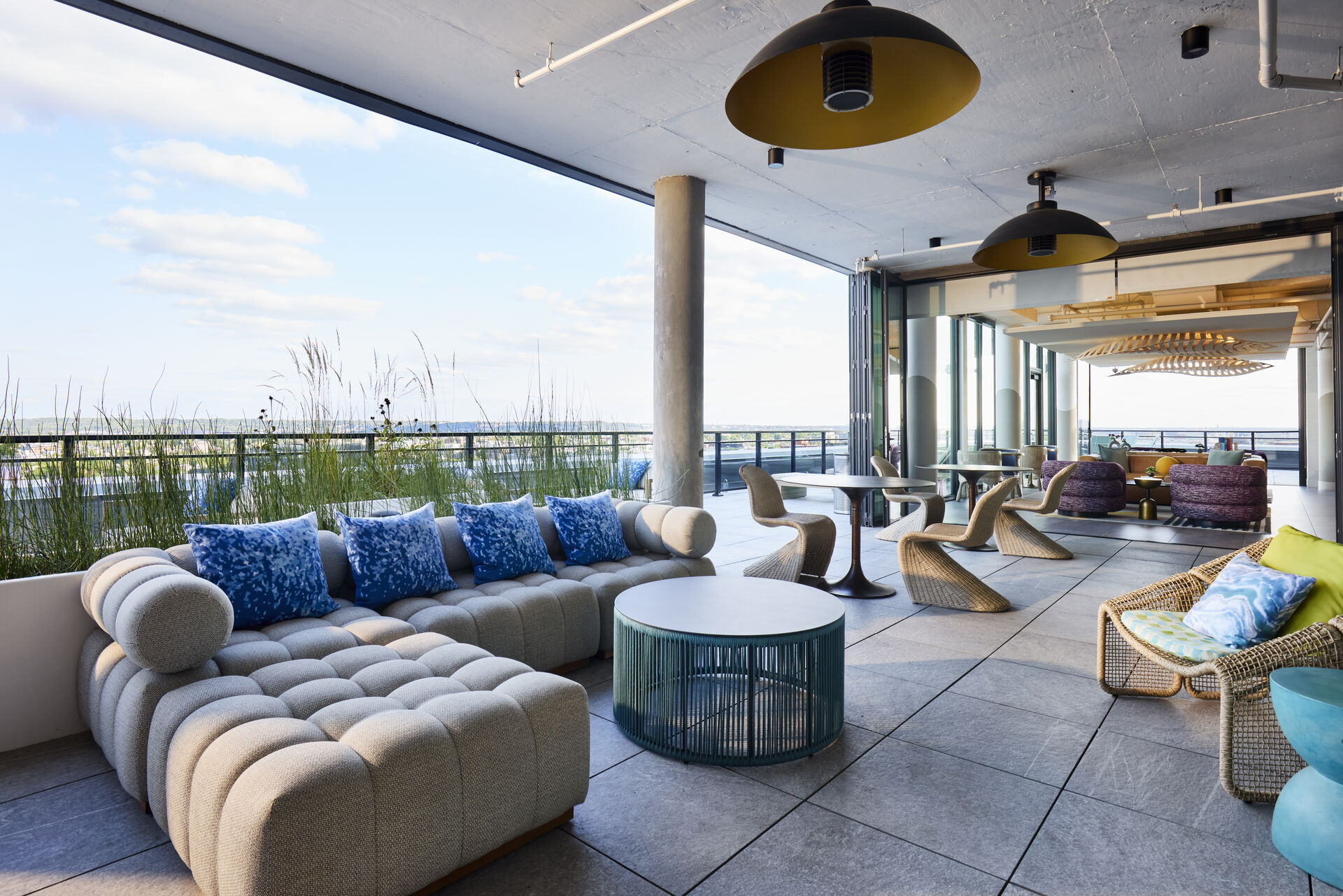 Outdoor lounge area at The 202 in DC, featuring stylish seating and greenery for a relaxing atmosphere.