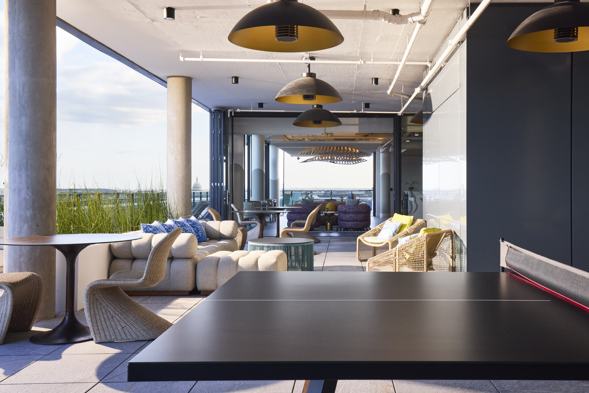 Outdoor lounge area at The 202 in DC, featuring stylish seating and a vibrant atmosphere for relaxation and socializing.