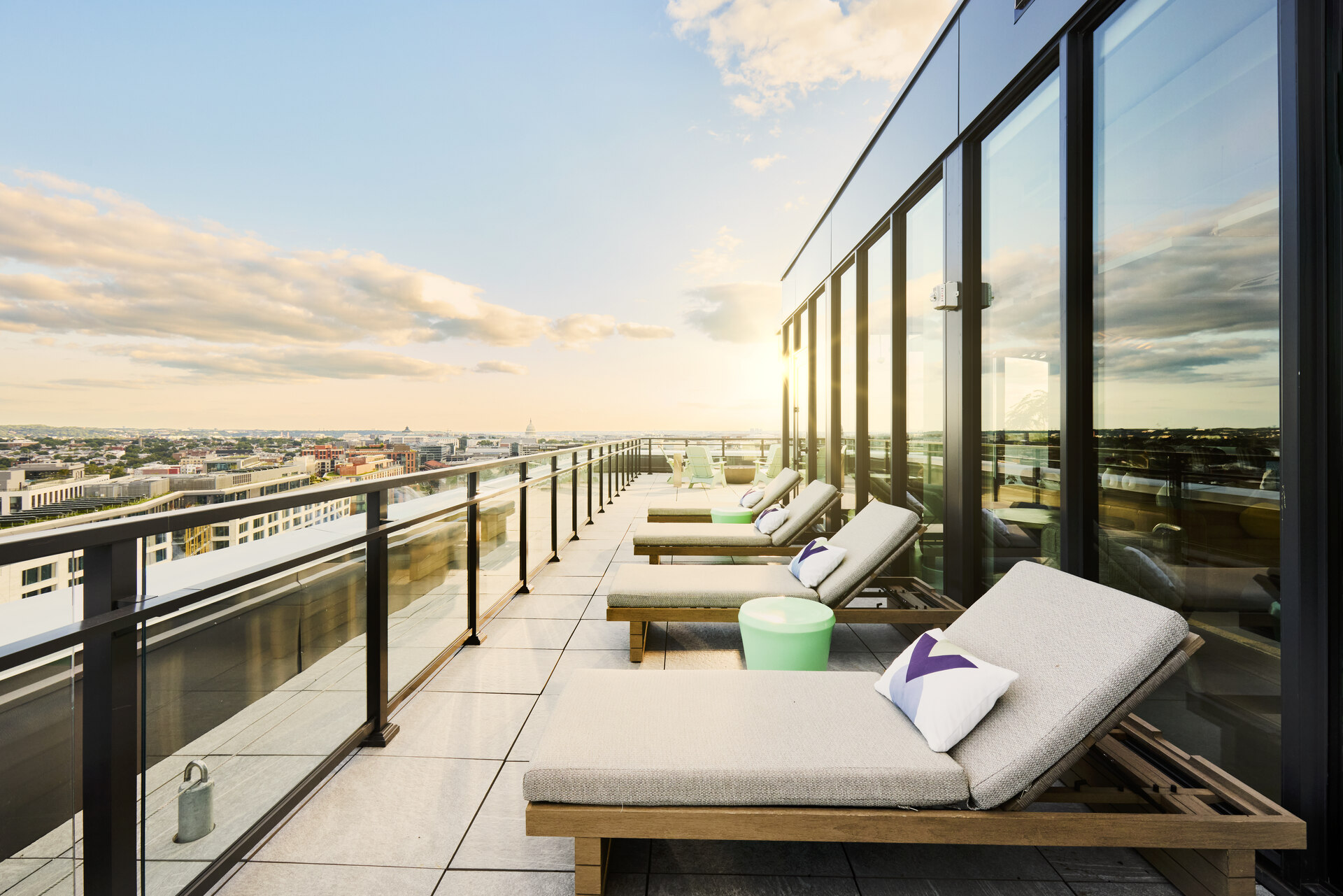 Outdoor lounge chairs at The 202 in DC, positioned for sunset viewing, creating a cozy and inviting atmosphere.