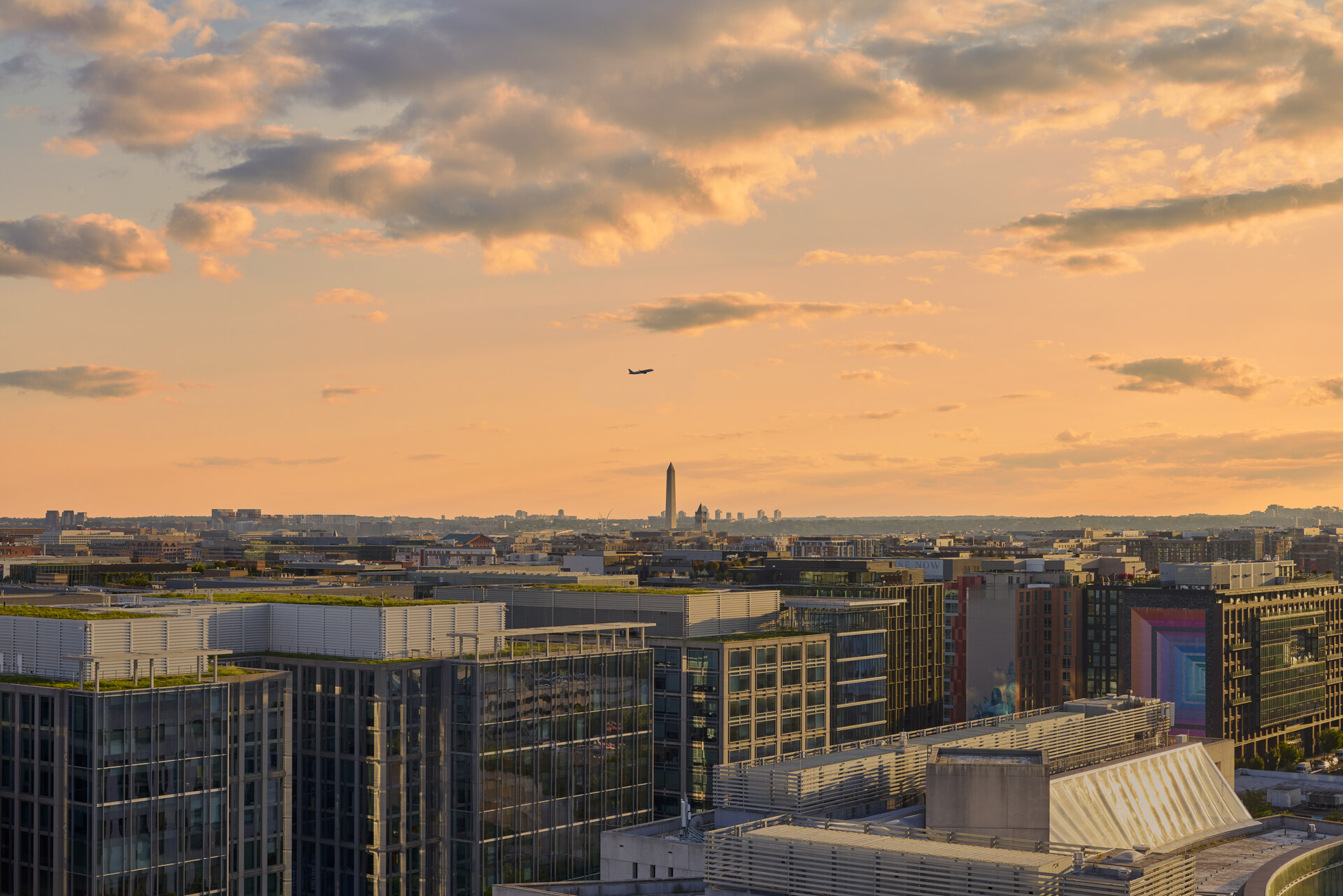 Aerial view of The 202 in DC during dusk, highlighting the modern exterior and surrounding urban landscape.