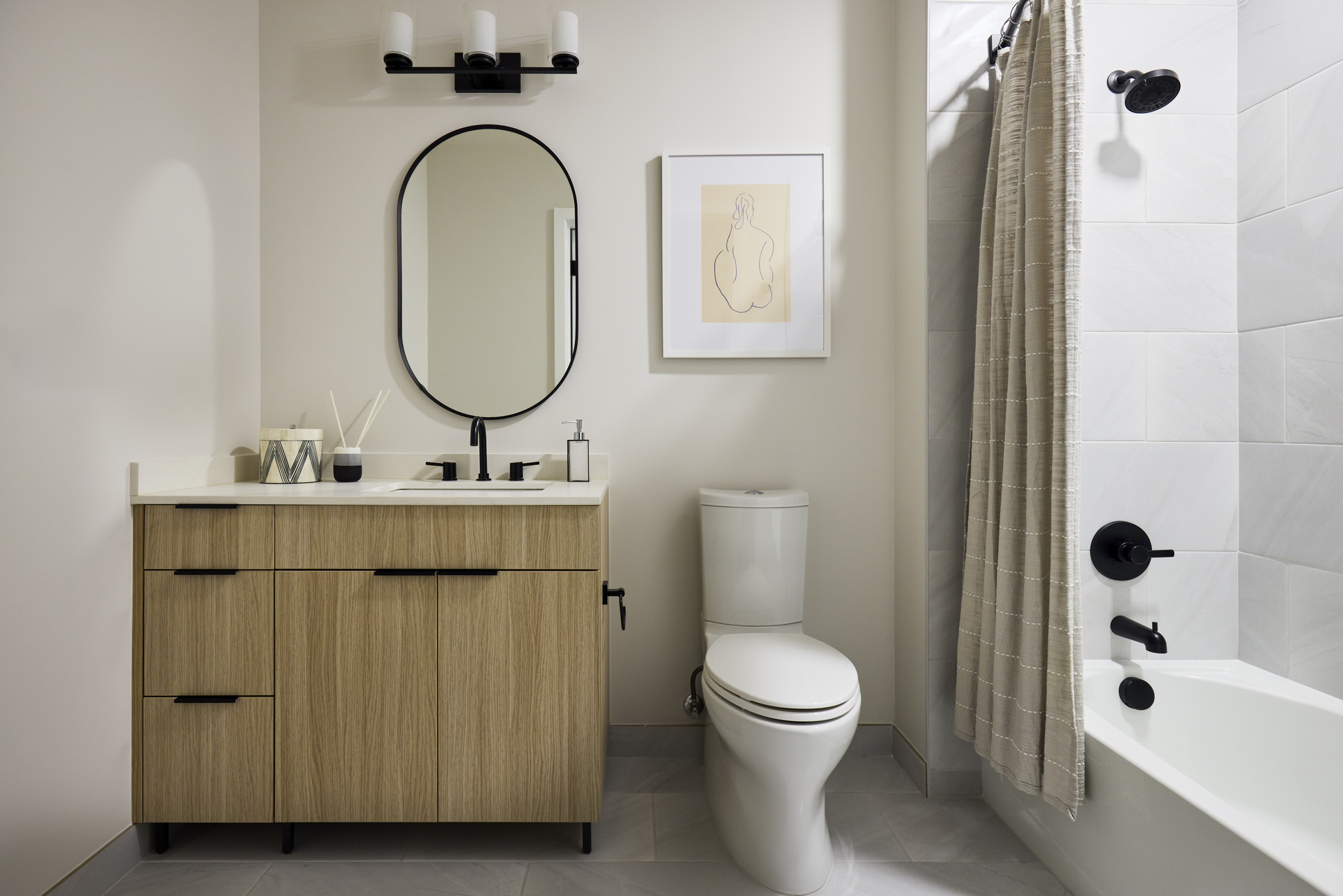 Bathroom in an apartment at The 202 in DC, featuring modern fixtures, stylish tiles, and a clean, contemporary design.