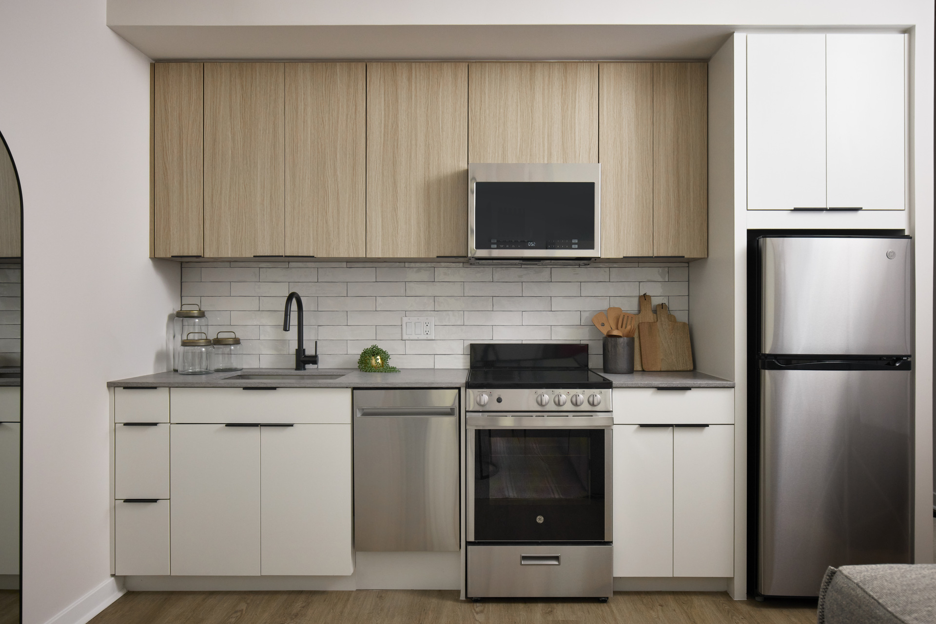 Modern kitchen in an apartment at The 202 in DC, featuring sleek cabinetry, stainless steel appliances, and a spacious layout.