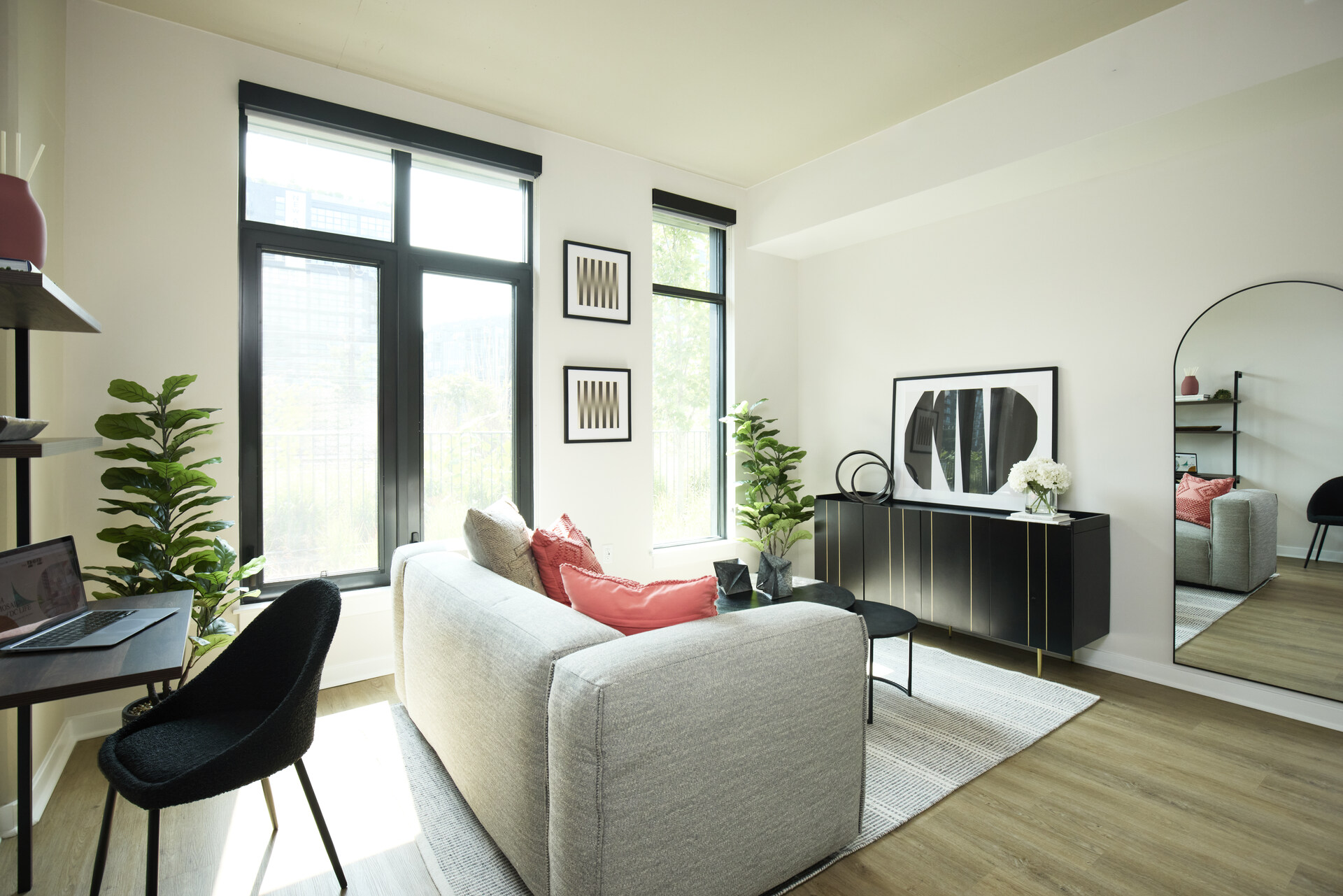 Modern living room in an apartment at The 202 in DC, showcasing a cozy seating area and contemporary decor.