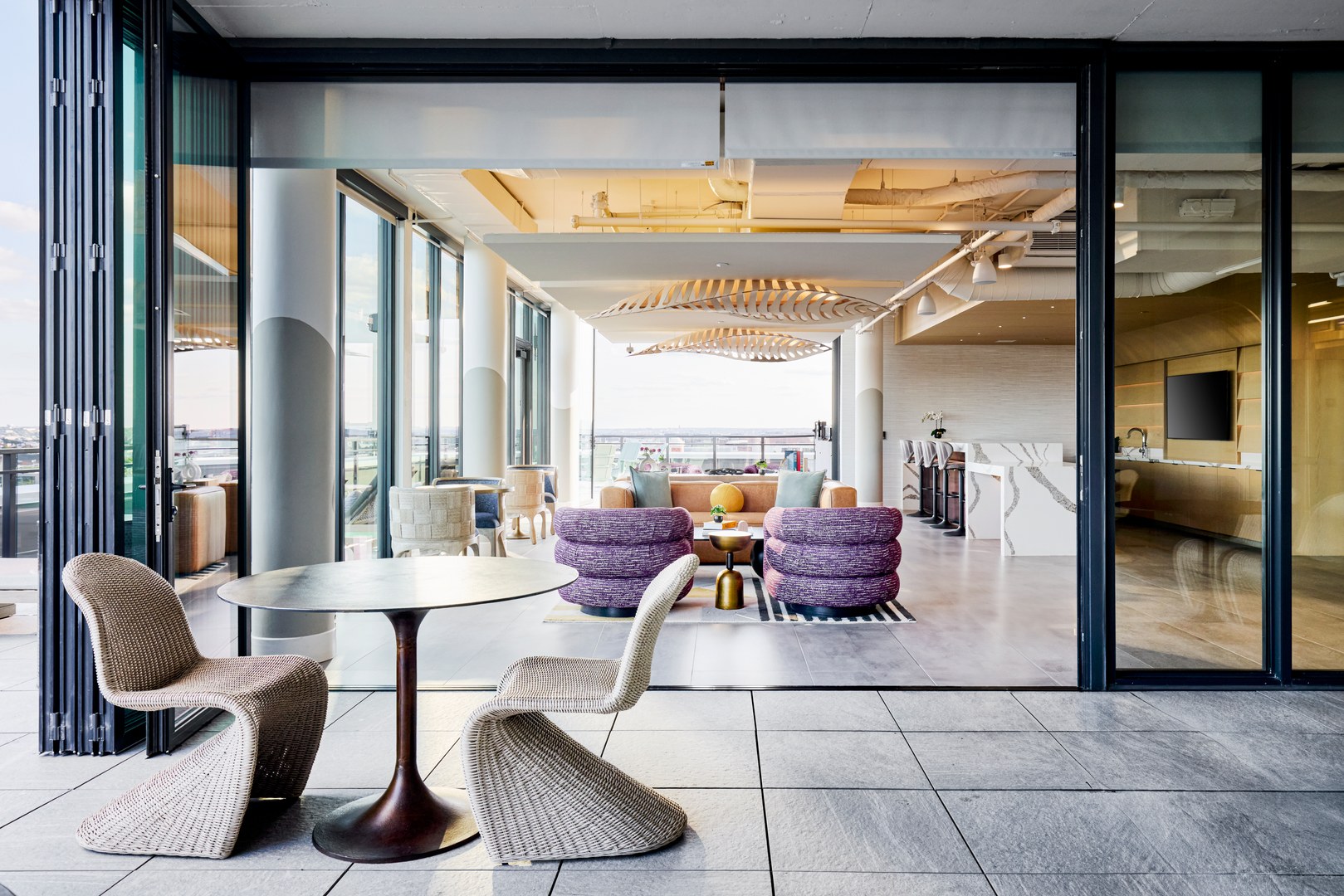 Outdoor lounge space with seating and a view